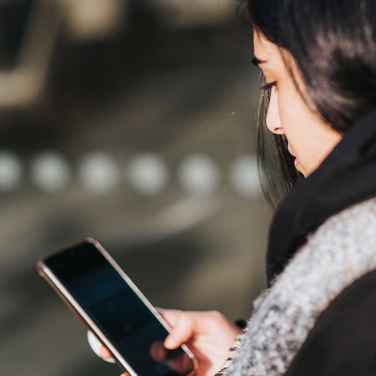 Woman Searches For Pregnancy Information On Her Mobile Phone.